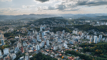 Fototapeta na wymiar aerial image of Blumenau city, Santa Catarina, southern Brazil, buildings, main streets, vegetation and sunny day