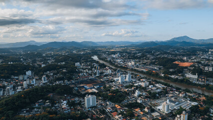 
aerial image of downtown Blumenau, with Itaja&iacute; A&ccedil;&uacute; River, Santa Catarina, southern Brazil, buildings, main streets, vegetation and sunny day