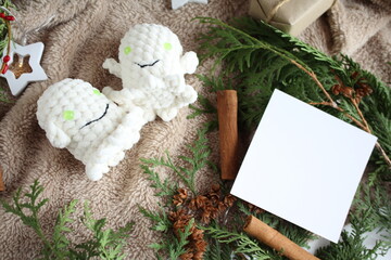 Knitted toys on a table. Natural. Knitted ghosts. Product layout. Knitting. Hobby. flatlay
