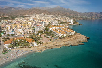 The drone aerial view of Nerja, Andalusia, Spain. Nerja is a municipality on the Costa del Sol in...