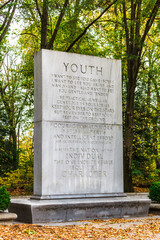 Granite stone tablet measuring 21-feet tall inscribed with quote from President Theodore Roosevelt on Youth at the memorial on Theodore Roosevelt Island in Washington, DC - obrazy, fototapety, plakaty