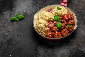 Pan with Italian pasta with tomato sauce and meatballs. Restaurant menu, dieting, cookbook recipe...