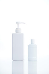 White containers and bottles isolated on white background
