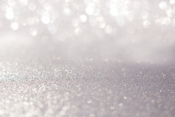 Blurred silver glitter background with sparkle. Christmas, New Year, March 8, birthday,...