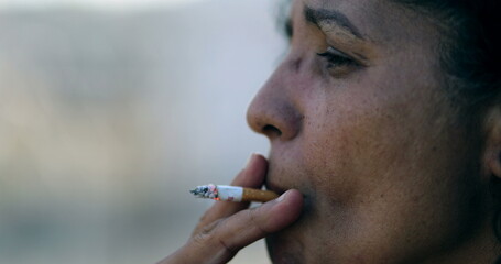 Sad depressed woman smoking cigarette. Real expression, tired person