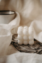 Obraz premium A candle burned on the table