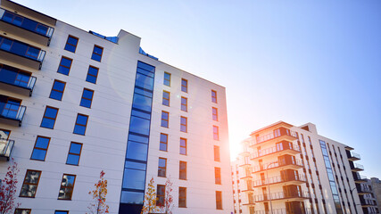 New apartment building on a sunny day. Modern residential architecture. The apartment is waiting for new residents.