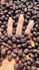 Hand and coffee beans background