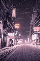 Obraz premium The city street is alive with activity despite the late hour. Cars zoom up and down the road, their tires kicking up snow in their wake. A light dusting of powder coats the sidewalks and windowsills o