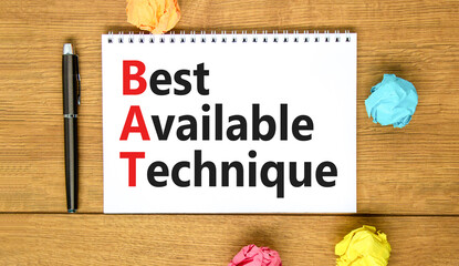 BAT best available technique symbol. Concept words BAT best available technique on white note on a beautiful wooden background. Business and BAT best available technique concept. Copy space.