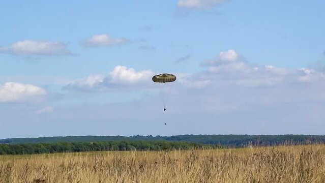 British army paratrooper soldier from 3rd Para Battallion descending on a parachute drop to a military zone, Wiltshire UK