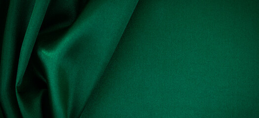 Abstract monochrome elegant luxury cloth background. Green color background with drapery and wavy...