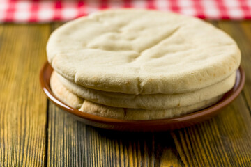 a few pita breads on the plate -