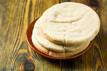 a few pita breads on the plate -