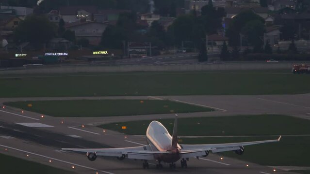 Wide body airliner takes off over the sea at Sochi airport. Tourism and air travel concept