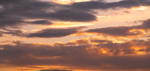 Naklejka na ściany i meble Beautiful dramatic sunset sky with clouds. Sunset sky background.