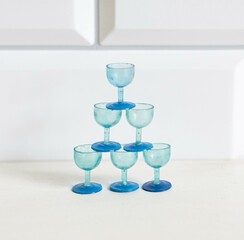 Miniature plastic champagne stemmed glasses for a dollhouse