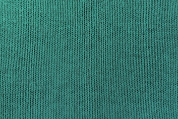 Knitted blue pattern closeup, detailed yarn background.