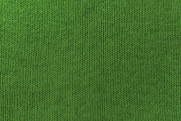 Knitted green pattern closeup, detailed yarn background.