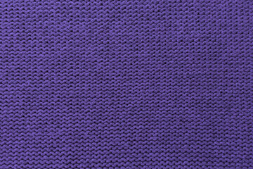 Knitted pattern closeup, detailed yarn background.