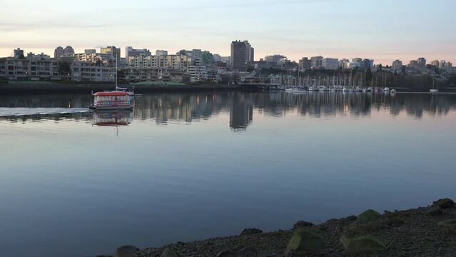 Vancouver, British Columbia, Canada &ndash; November 18, 2018. False Creek Aquabus Morning Commute 4K UHD. A False Creek Aquabus travels at sunrise in Vancouver. British Columbia, Canada. 4K UHD.

