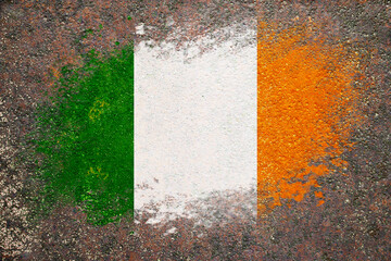 Flag of Ireland. Flag is painted on a rusty surface. Rusty background