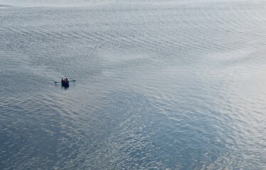 a boat on a blue lake