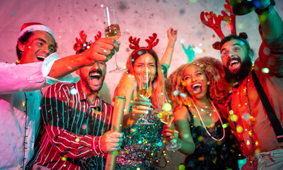 Friends making a toast at New Year party midnight countdown