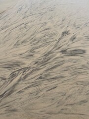 sand and water making random abstract patterns 
