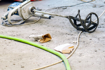 Concrete mixer lies on the ground after use