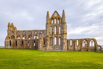 Sunset view of Whitby abbey overlooking the North Sea on the East Cliff above Whitby in North...