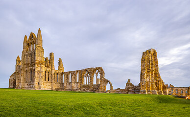 Fototapeta na wymiar Sunset view of Whitby abbey overlooking the North Sea on the East Cliff above Whitby in North Yorkshire, England