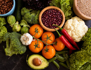 Different vegetables, fruits, cereals on the old background