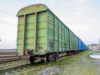 Fototapeta na wymiar Old freight wagons on the tracks. Railway Trucking industry.