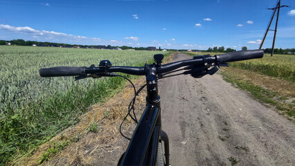 Fototapeta na wymiar Gravel bicycle ride on the road in the summer season