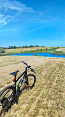 Obraz premium Gravel bicycle ride on the road in the summer season