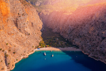 Amazing beach Butterfly Valley with blue water in Oludeniz Fethiye Turkey, aerial top view