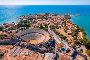Fototapeta premium Antique amphitheater of ancient Side city Antalya Turkey drone photo, aerial top view