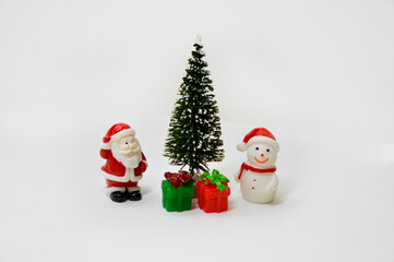 christmas card: santa claus, snowman, fir-tree and gifts on a white background. the concept of celebrating christmas and new year, congratulations on the holiday and giving gifts