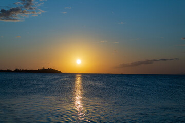 sunset on the beach, dusk with sea and sand