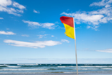 Red Yellow Flag on Beach