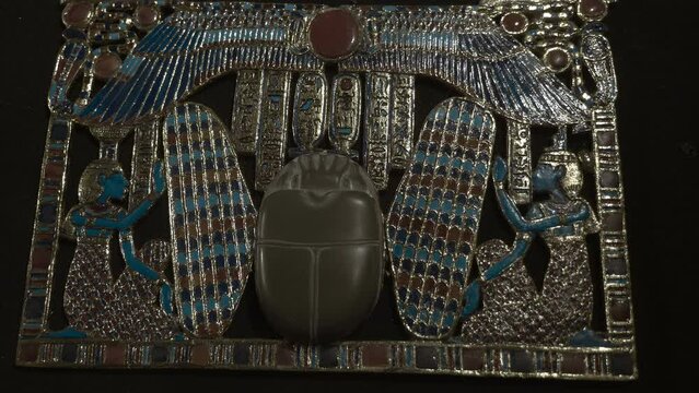 Golden ancient egyptian jewelry is one of the exhibits of the tomb of Tutankhamen, a symbol of Ancient Egypt. Shot in motion. Closeup