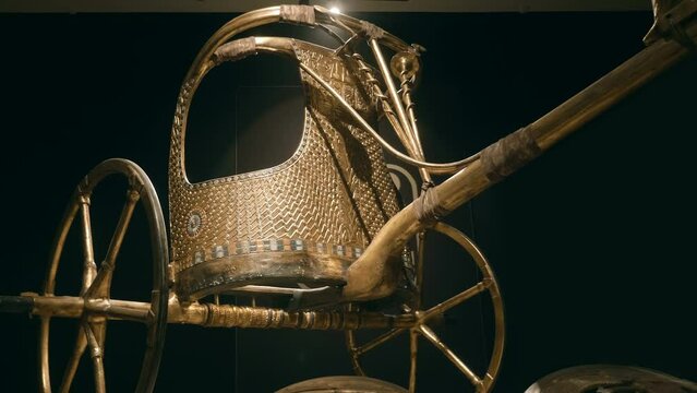 Royal golden parade chariot one of the exhibits of Tutankhamun's tomb, a symbol of Ancient Egypt. Shot in motion