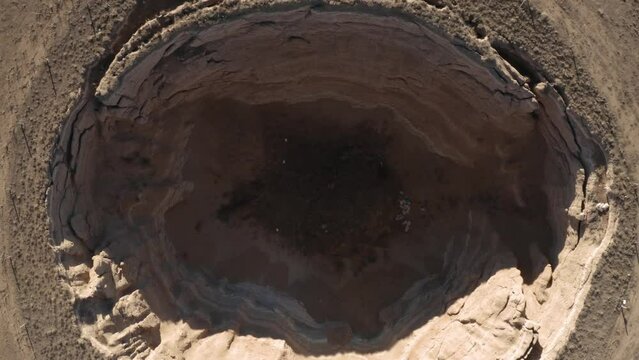 A large sink hole formed by collapsing of a large area of soil in Turkey.