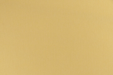 texture of ocher synthetic fabric closeup. place for your design