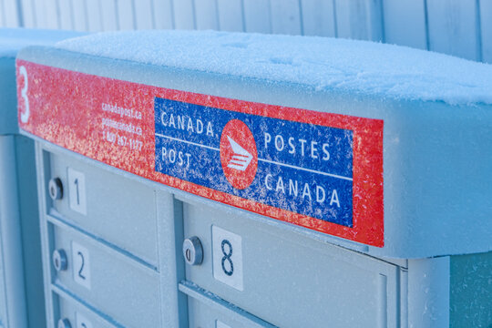 Calgary, Alberta, Canada Nov 3, 2022. A Canada Post Mail Box Cover With Snow During Winter