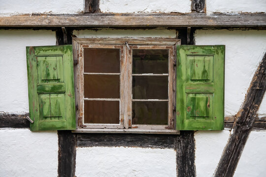 Old wooden window with the vintage shutter
