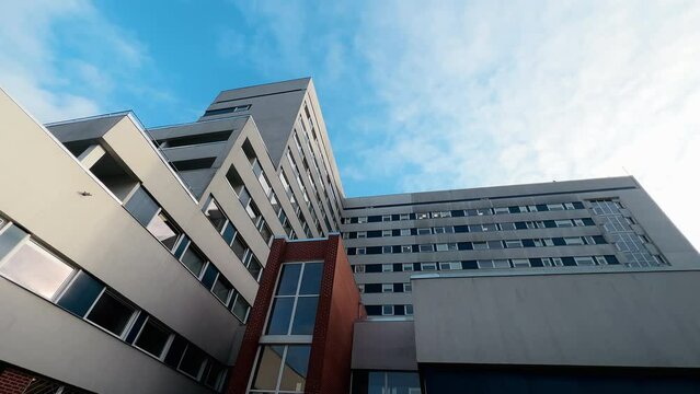 Wide angle: Hospital building during COVID-19 pandemic over blue sky