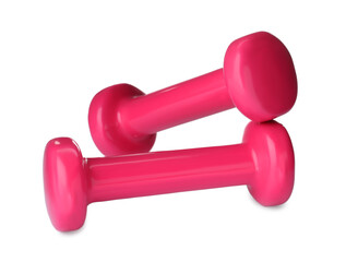 Pink dumbbells on white background. Weight training equipment