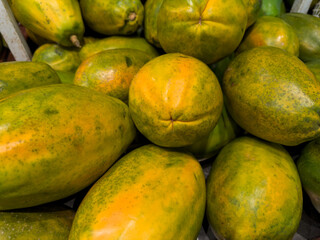 Fresh papaya in the supermarket. Vegetables and fruits exposed for the consumer to choose